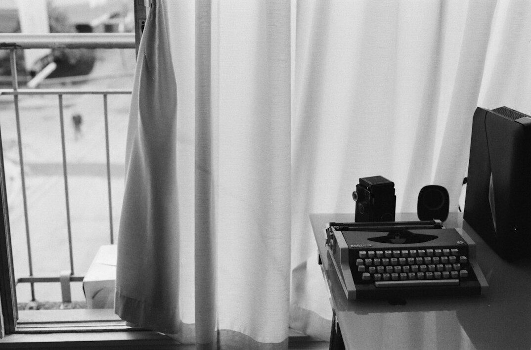 Editorial desk with magazines, notebook and coffee cup